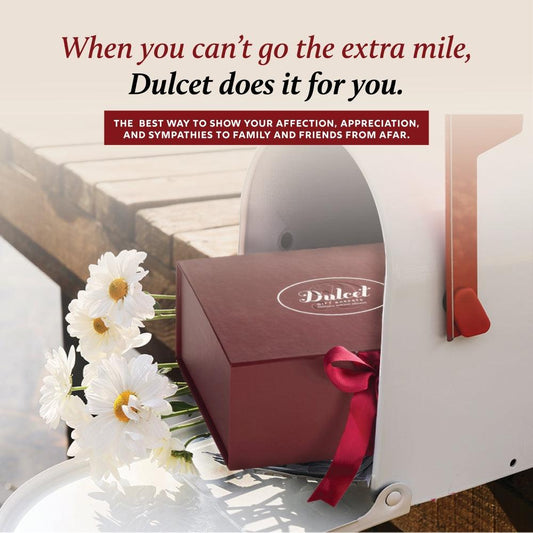 Dulcet gift basket box with logo, pink ribbon bow and white flower accents
