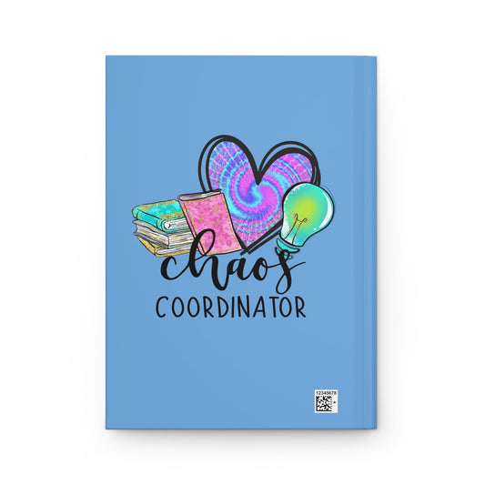 Blue matte hardcover journal front with 'Chaos Coordinator' text and small barcode
