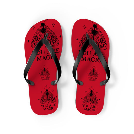 Red flip flops pair with black straps, 'YOU ARE MAGIC' graphic