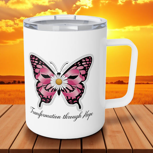 White insulated coffee mug with pink butterfly emblem on front and “Transformation through Hope”