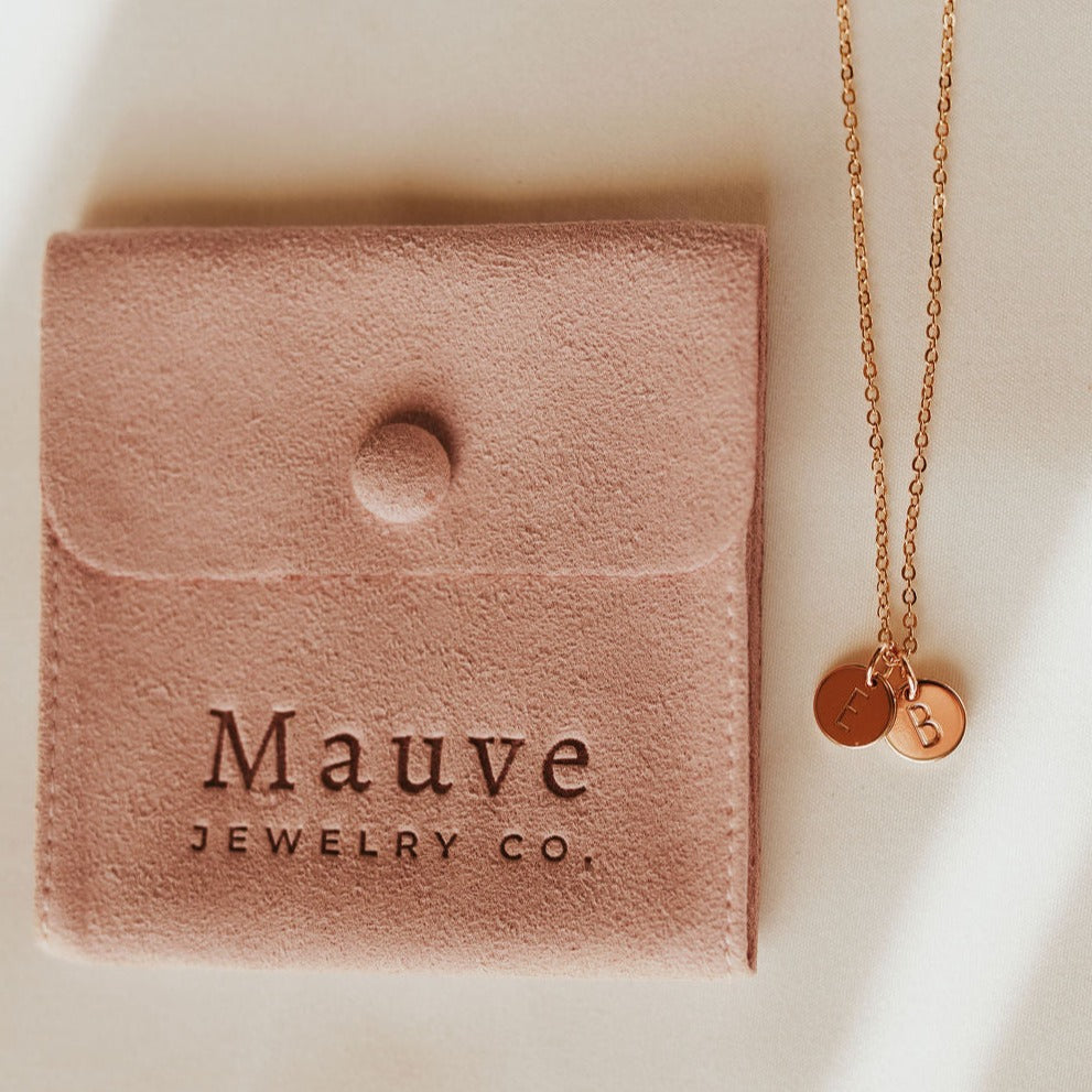Gold-tone necklace with overlapping E and B initial charms