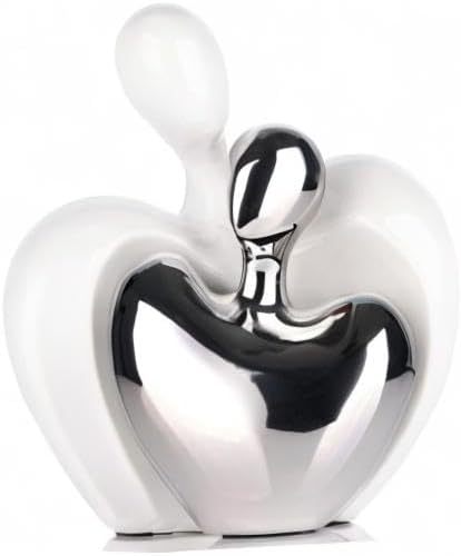 Close-up white ceramic and silver hugging couple heart figurine, glossy finish.