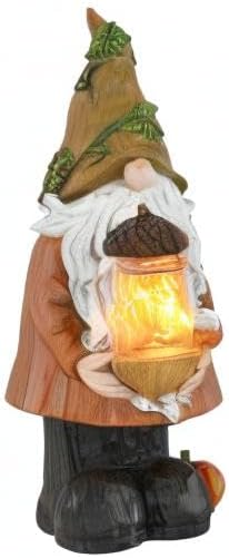 Autumn garden gnome figurine holding glowing lantern, white beard and green hat