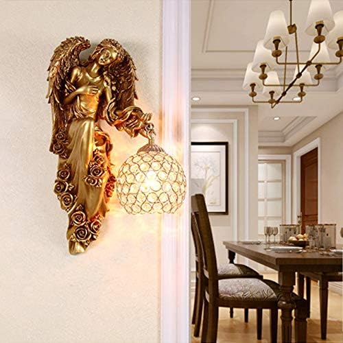 Gold angel wall lamp with clear crystal globe shade on wall
