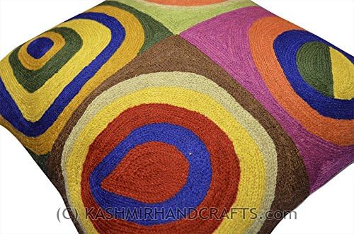 Wool pillow cover, diagonal close view, large abstract circular rings in yellow, blue, and red