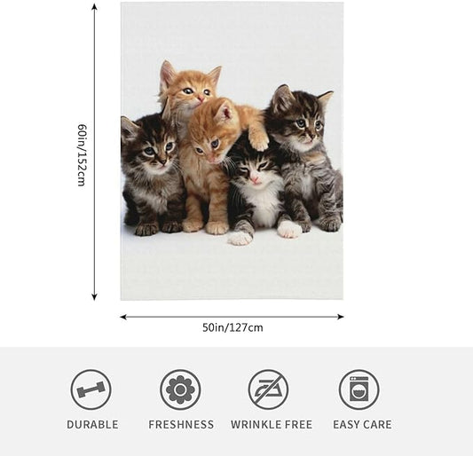 Cats throw blanket with kitten group print, shown laid flat with light background