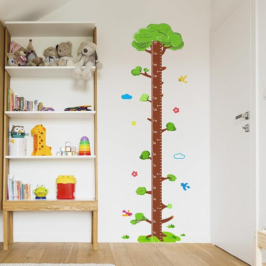 Tree vinyl growth chart decal on nursery wall with clouds, flowers, and leaf accents