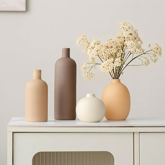 Set of 4 matte ceramic vases with tall and round forms in neutral tones