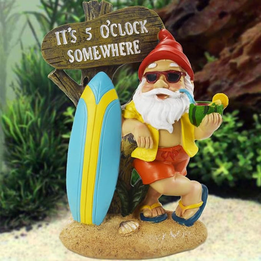 Outdoor garden gnome statue with surfboard and "It's 5 O'Clock Somewhere" sign, red hat.