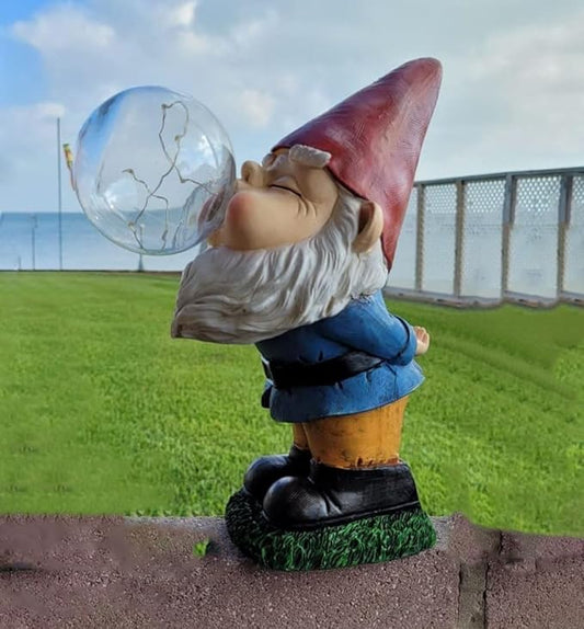LED solar garden gnome statue with red hat, white beard, holding clear bubble lantern