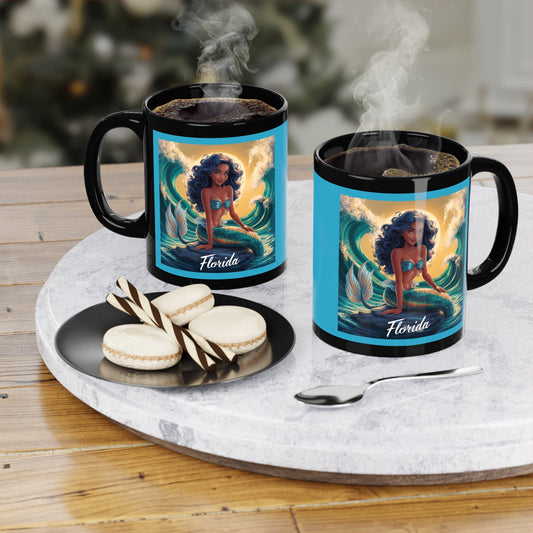 Black 11oz coffee mug with mermaid 'Florida' graphic, steam rising from cup