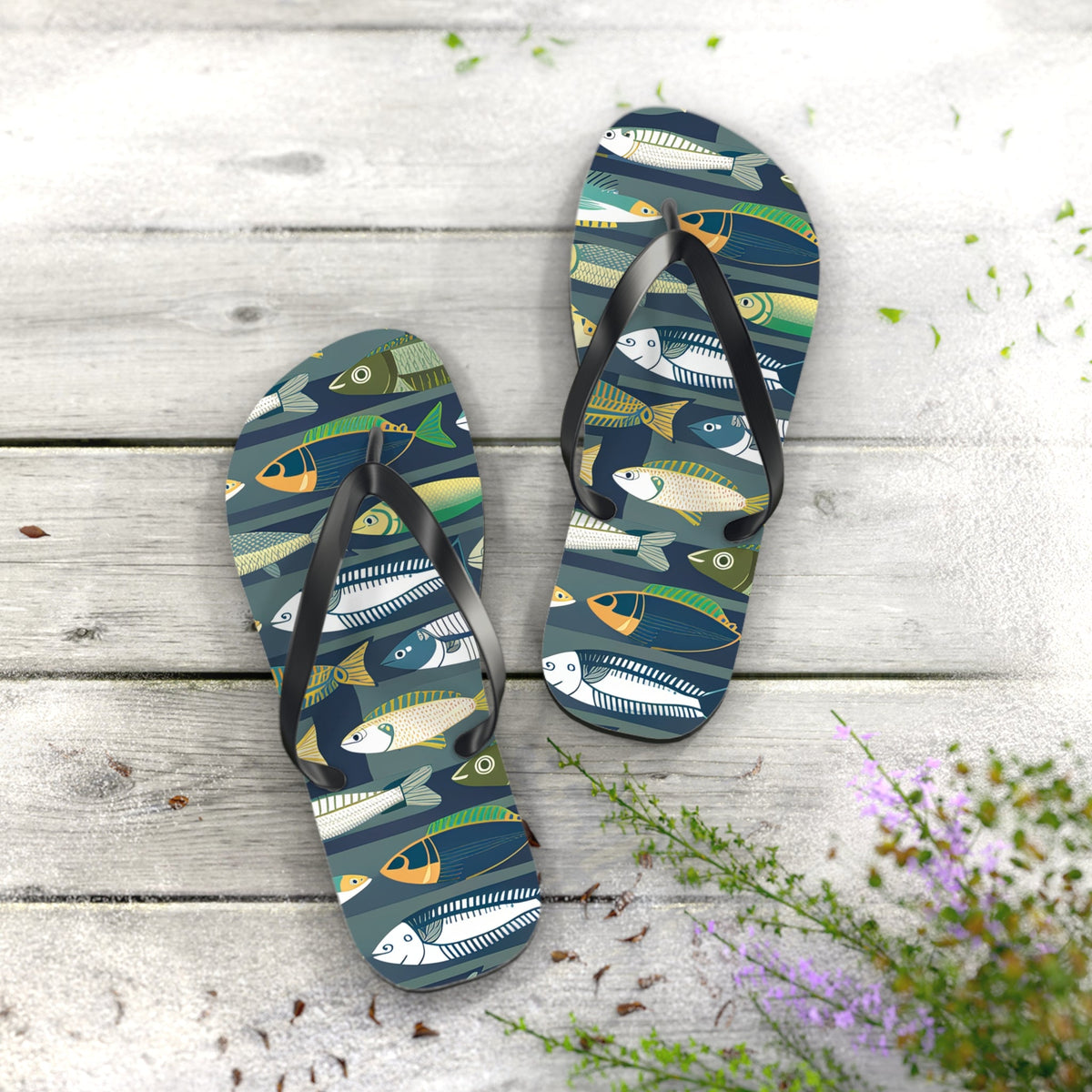 Pair of fish-print flip flops with black thong straps and dark blue patterned footbeds