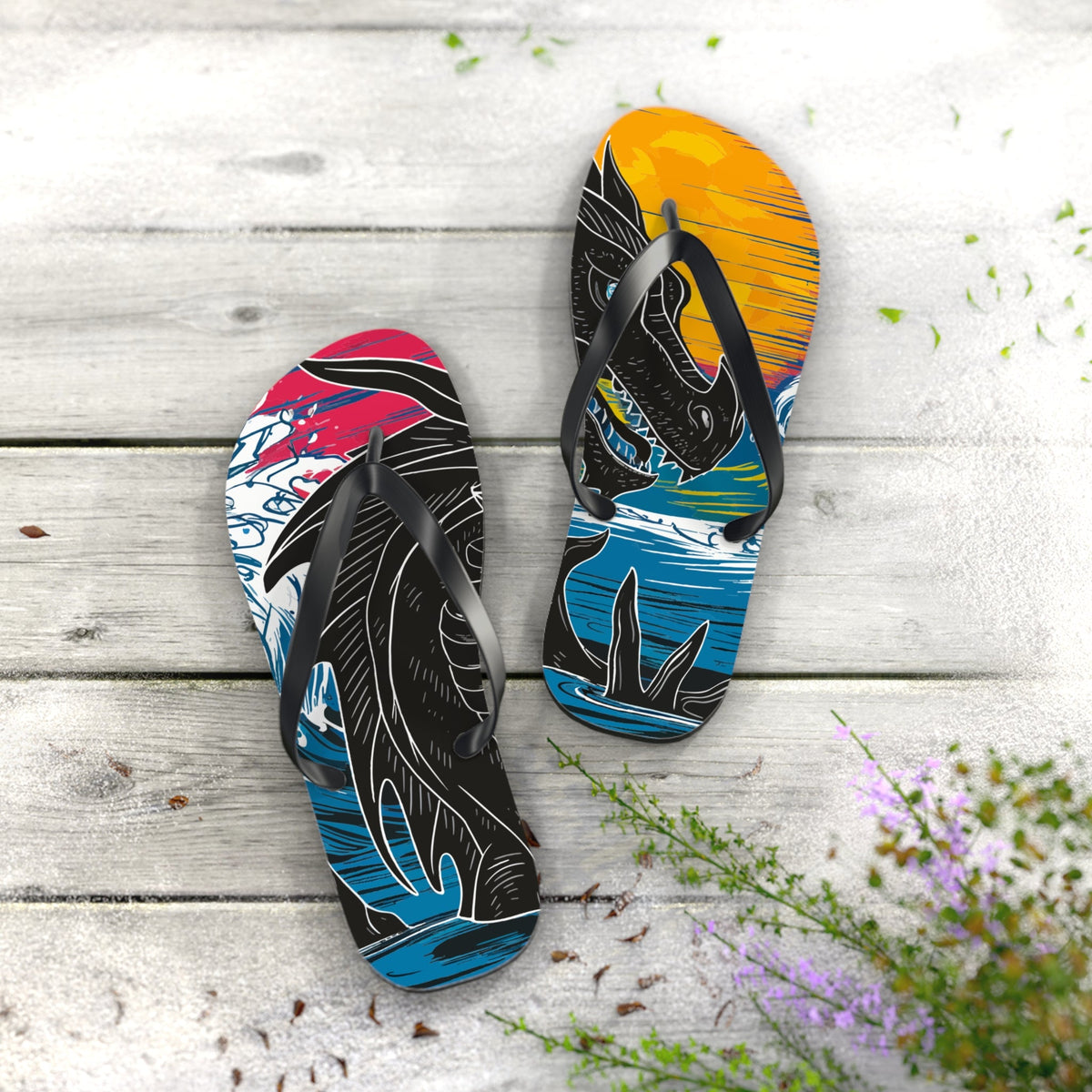 Dragon flip-flops with black straps and multicolor dragon print, shoes side by side