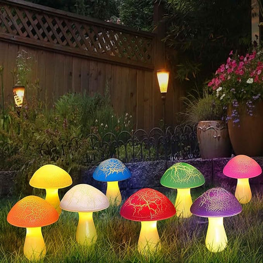 Glowing multicolored solar mushroom lights with cracked caps and yellow stems