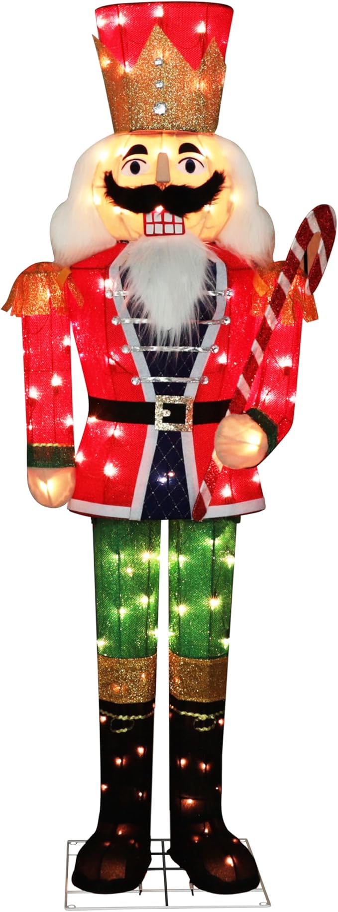 Standing lit nutcracker soldier with red coat, green pants, and candy cane