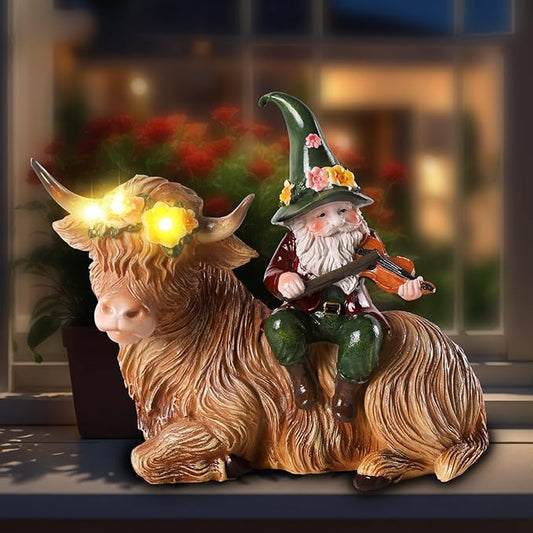 Solar resin highland cow figurine with gnome violinist, glowing bulbs on cow