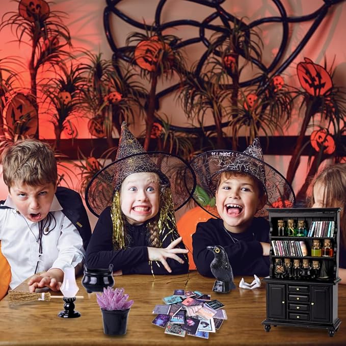 Wizard dollhouse miniatures set with potion bottles, black cabinet, and cauldron pieces
