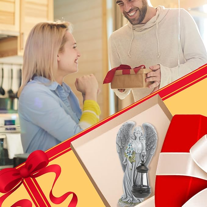 Gray angel garden statue figure inside a gift box, wings and lantern visible.