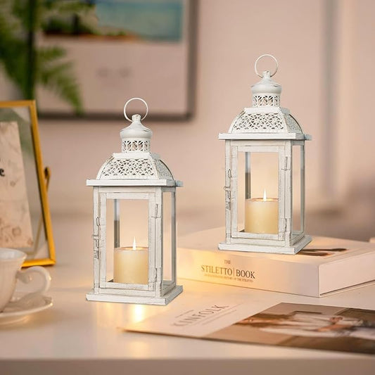 Pair of white metal hanging candle lanterns with openwork tops and glass sides
