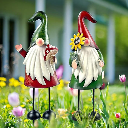 Two metal gnome stakes in green and red hats, white beard, yellow flower detail
