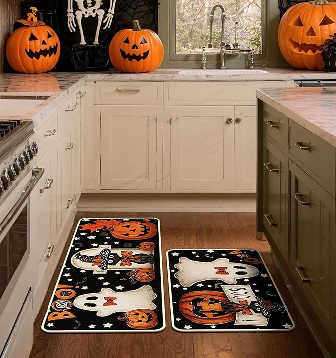 Pair of Halloween kitchen rugs in black with ghost, jack-o'-lantern pumpkins and stars