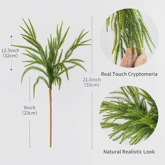 Green faux pine branch with realistic needle texture on a brown stem