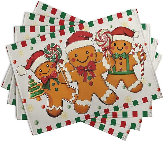 Four-pack Christmas gingerbread placemats, red-and-green candy stripe trim around figures