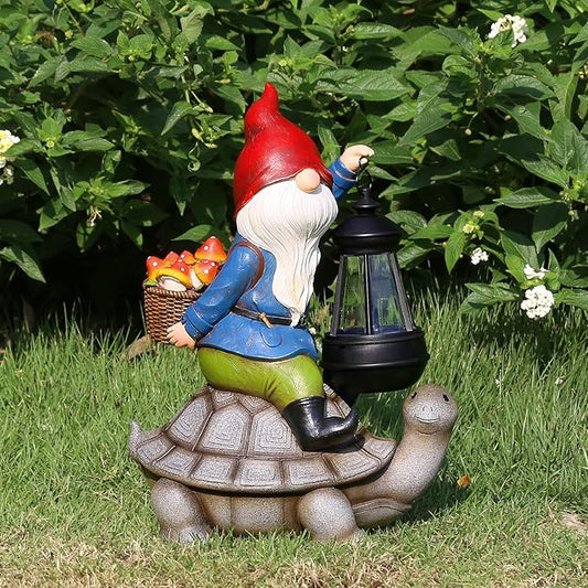 Red gnome garden statue carrying a solar lantern, seated on a turtle shell base