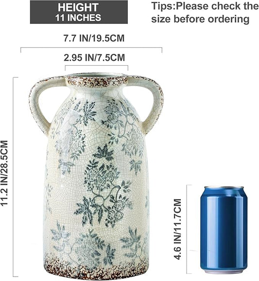 Blue-and-white ceramic pitcher vase, arched handles, decorative floral design; height 11 inches