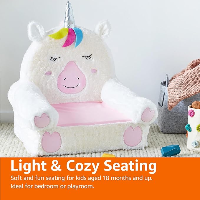 Unicorn plush toddler chair with rainbow mane, pink seat cushion and heart-shaped arm pads