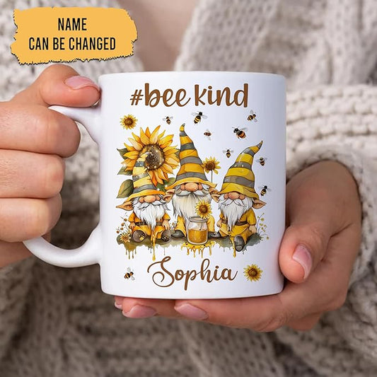 White ceramic mug held in hands with bee gnomes, #bee kind and Sophia name