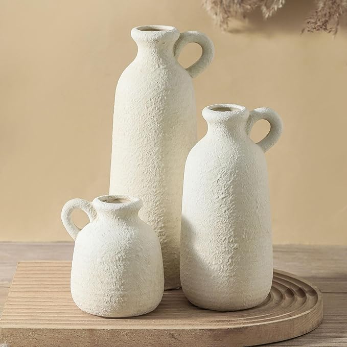 Set of 3 white ceramic vases with loop handles, three textured shapes on a round tray