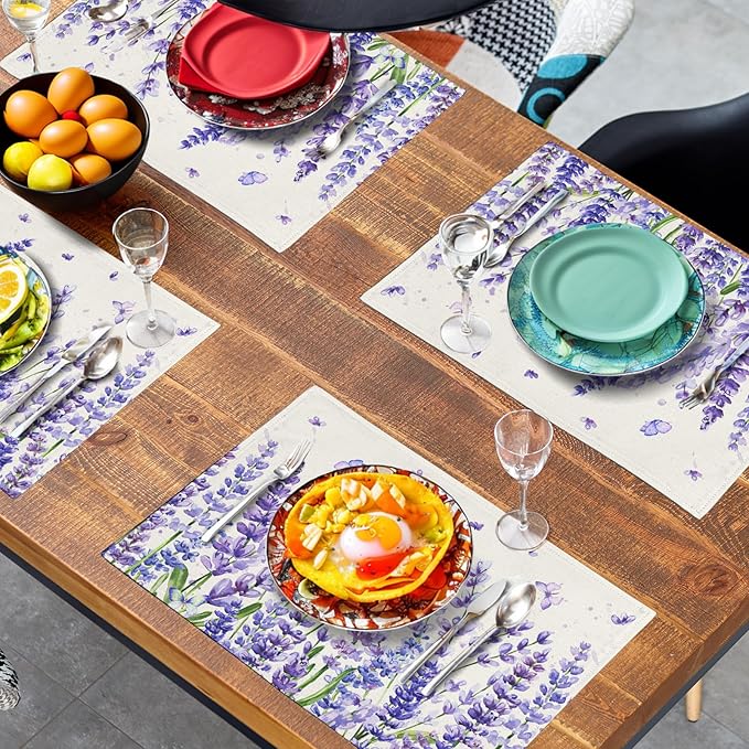 Square placemat set with purple lavender and butterflies, placed across a wooden table.