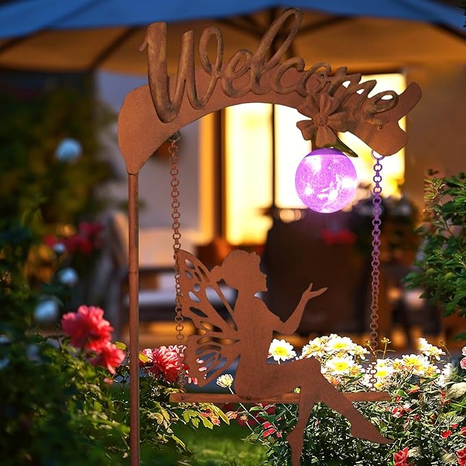 Solar fairy garden light with rust stake, fairy cutout, and glowing purple sphere