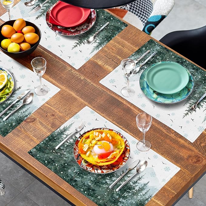 Forest Christmas placemat set on table: pine trees and snowflake pattern in green