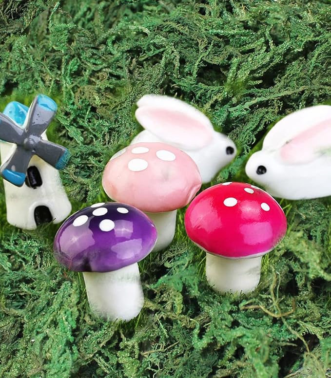 Dark green artificial moss surface with small mushroom figurines