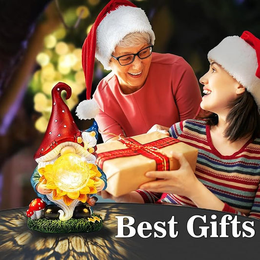 Solar gnome garden decor with red hat and glowing sunflower, shown beside wrapped gifts