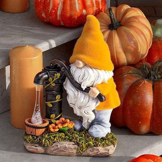 Outdoor fall gnome with orange hat and white beard, holding a black water pump lantern