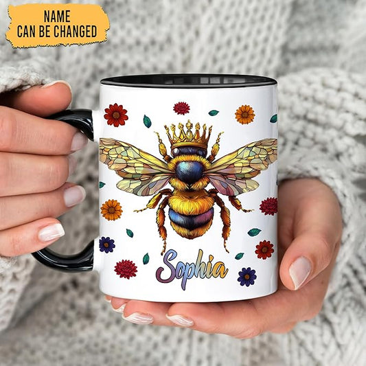Ceramic coffee mug held in hands, bee crown and floral design with name Sophia