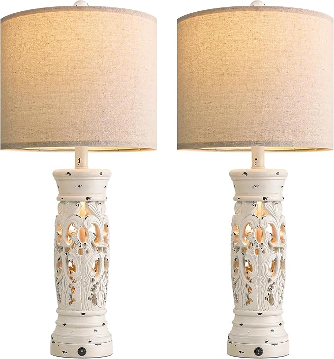 Two matching farmhouse table lamps with beige drum shades and white carved bases