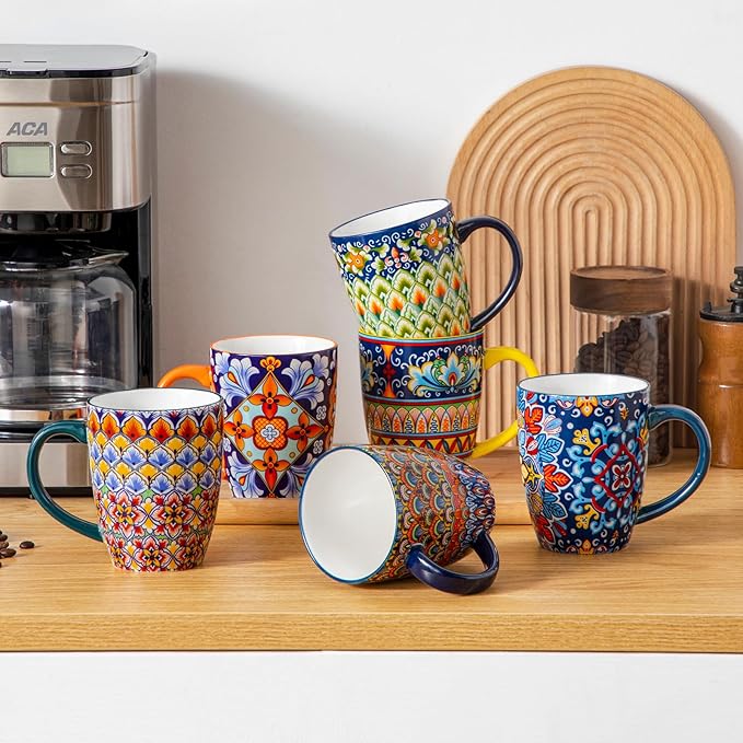 Boho ceramic coffee mug set with handles, multi-color geometric and floral designs on stand
