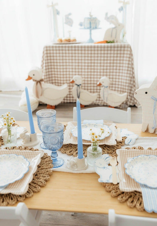 White duck piñatas (large) arranged on the party table for spring