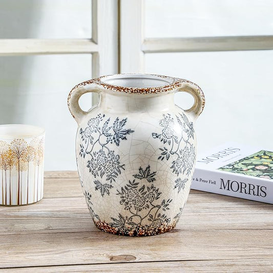 Double-handled ceramic vase with blue floral pattern, white body