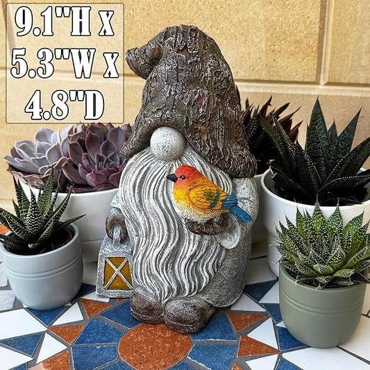 Garden gnome figurine with swirled gray robe and perched orange bird.