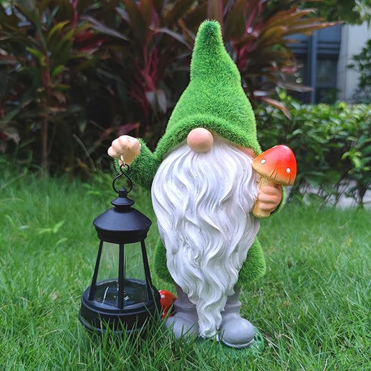 Outdoor solar gnome figurine with green hat, white beard, holding mushroom and lantern