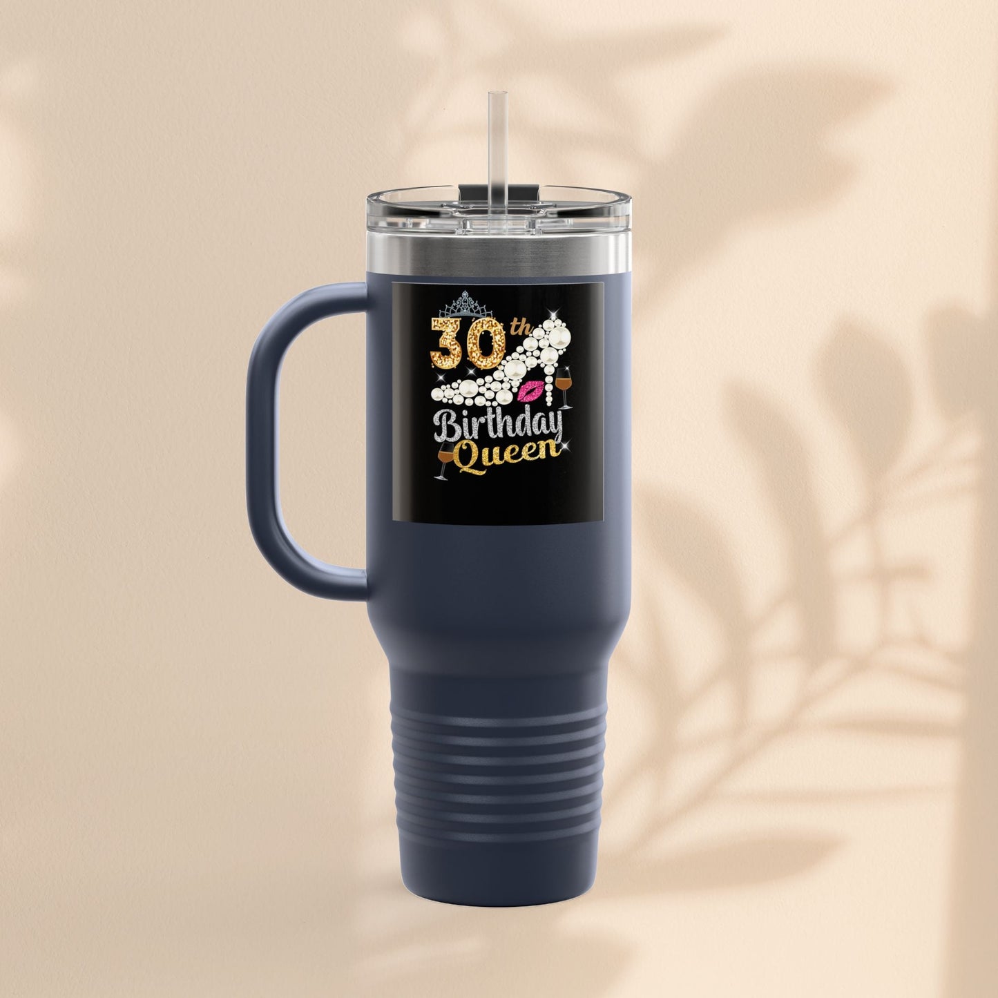 Dark blue insulated travel mug tumbler with handle, clear lid, straw, and birthday queen graphic