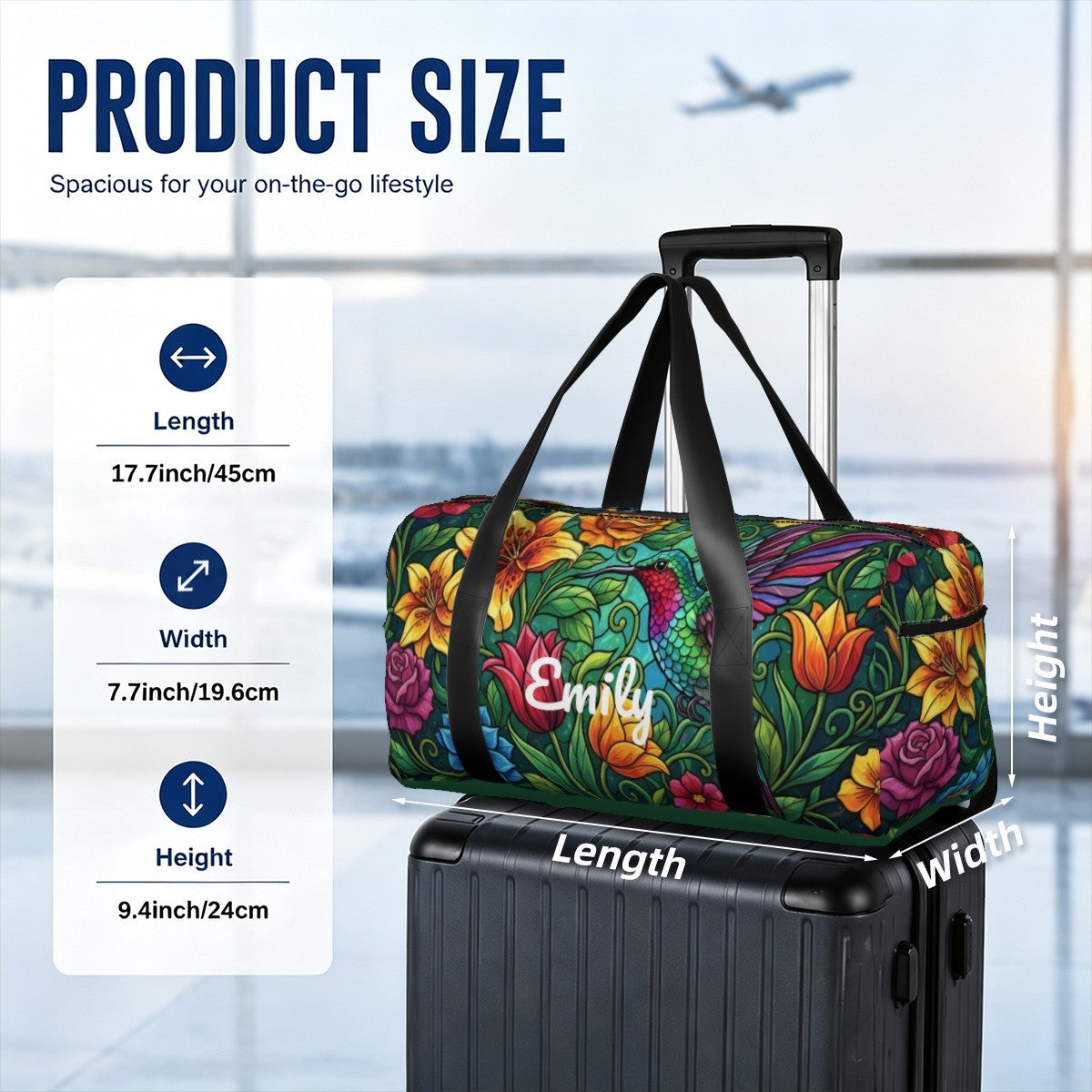 Floral duffel bag with black straps and Emily logo, mounted on suitcase handle