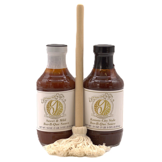 Two bar-b-que sauce bottles with wooden brush and bundled twine