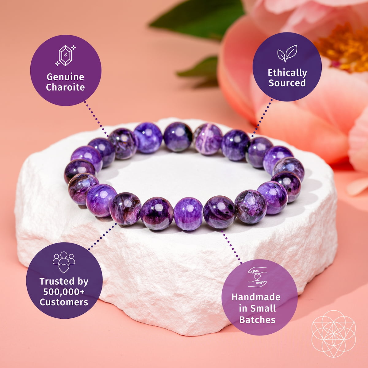 Purple charoite bead bracelet with round stones arranged on stone surface