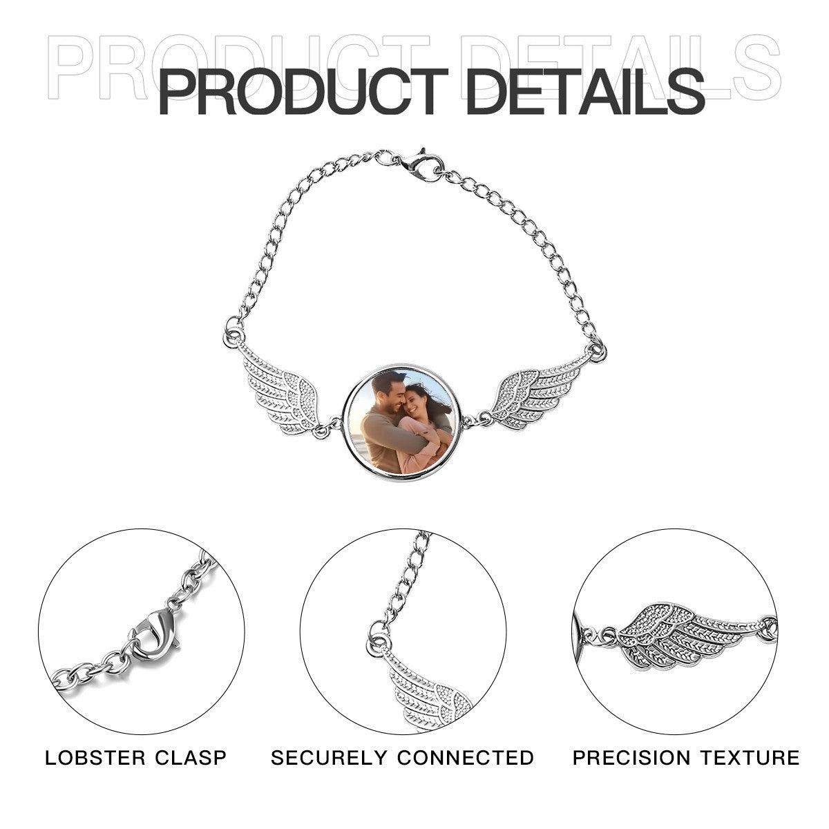 Silver photo bracelet with round locket and angel wings; lobster clasp shown